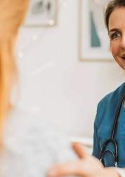 Female Doctor with red-haired patient